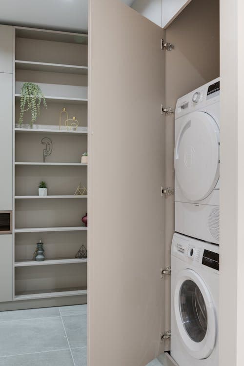 Stacked washer and dryer unit in a home laundry area